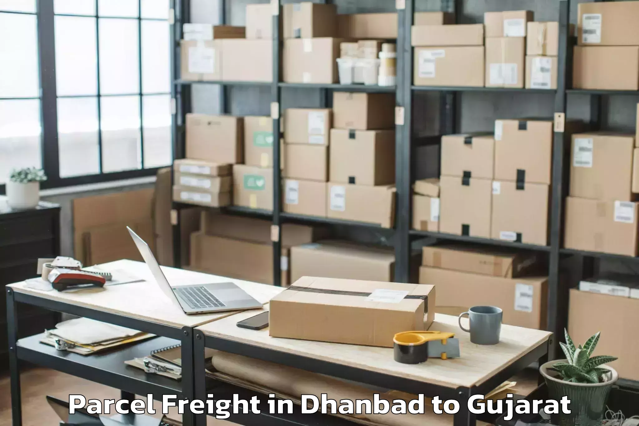 Easy Dhanbad to Porbandar Parcel Freight Booking